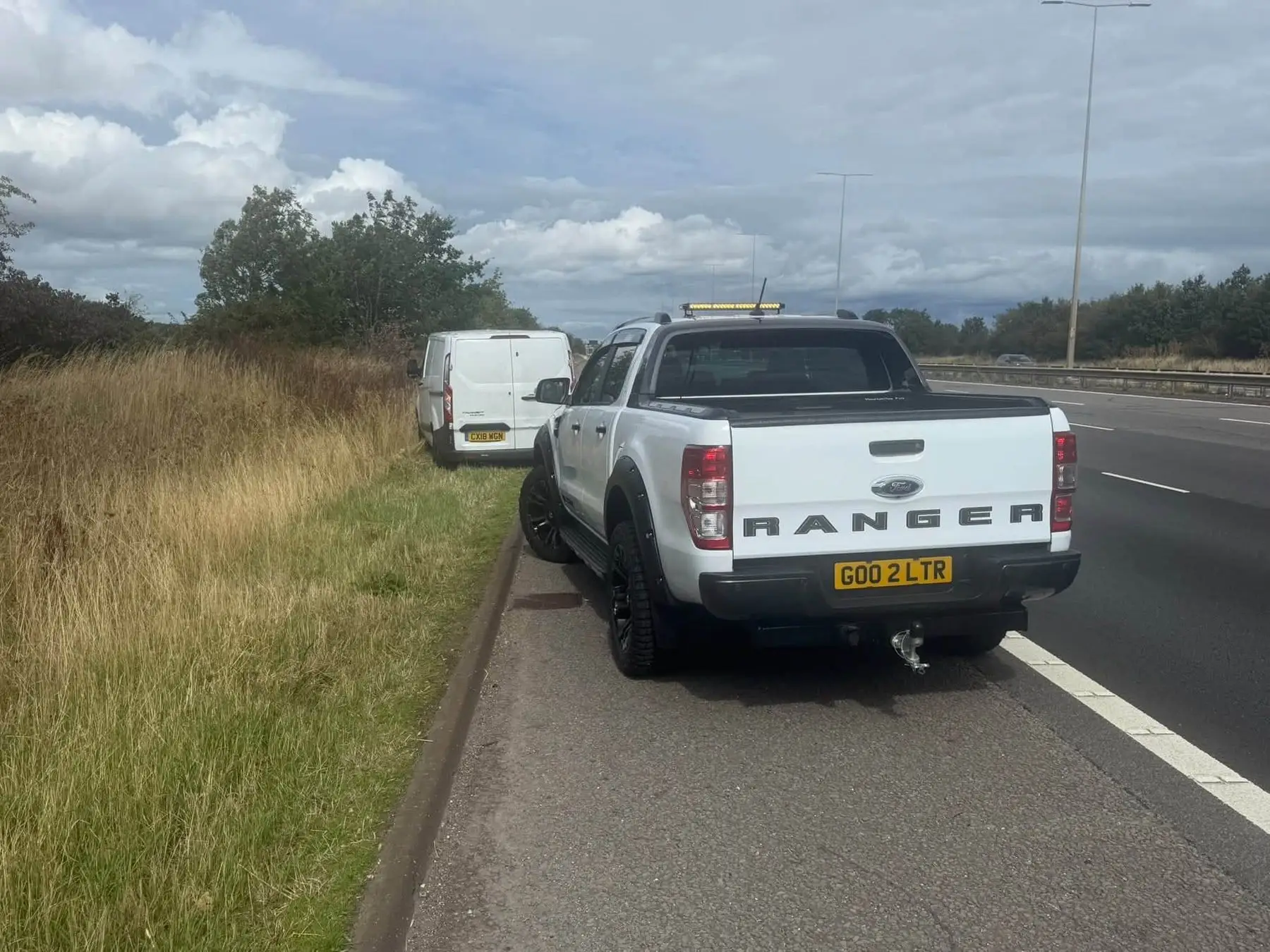 Covering a van with a blowout on the hard shoulder